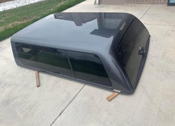 ARE camper shell off 2016-2023 Toyota Tacoma. 6' bed