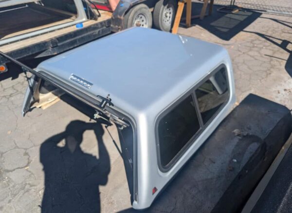 Used 05-22 Nissan Frontier crew cab short bed  camper shell